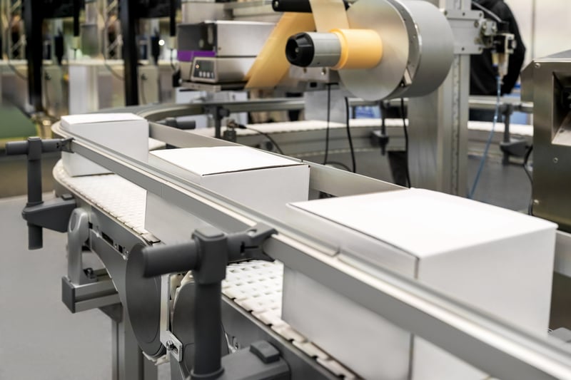 Adhesive application packaging line