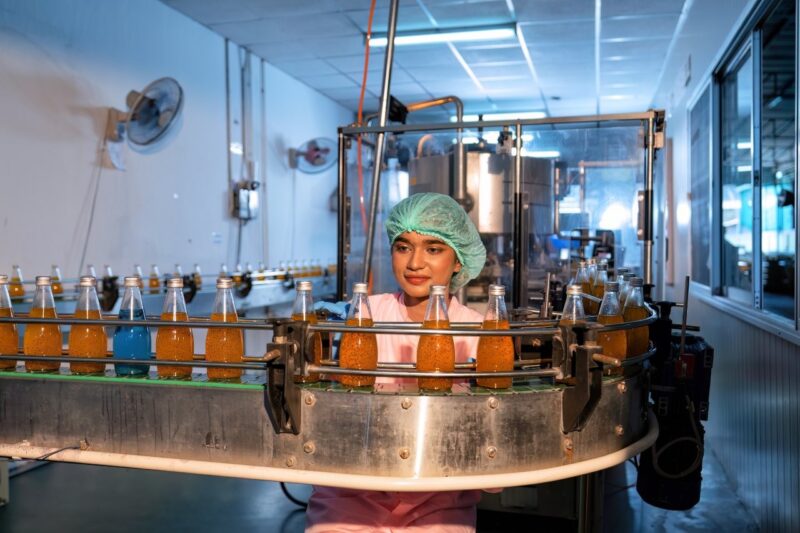 Beverage worker in drink factory stand working nea 2026 01 05 06 00 08 utc