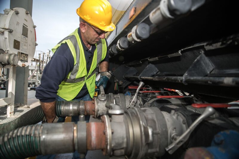 Engineer transfering fuel